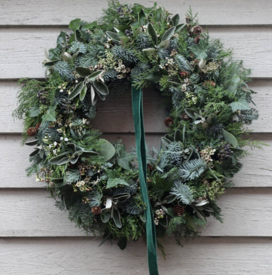 Understated elegance by The Garden Gate Southwold. Fresh evergreen wreath with green velvet ribbon.