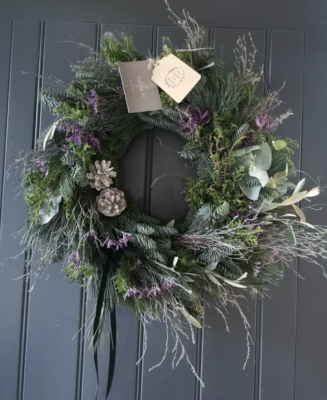 A fresh evergreen Christmas wreath with spruce, cones and wisps of dried flowers by Isla and Me, Lancashire