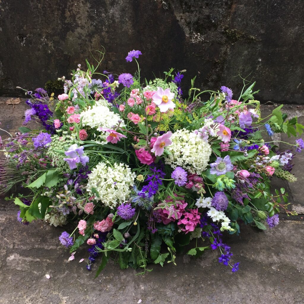 A wildflower style summer funeral tribute by Picking Posies