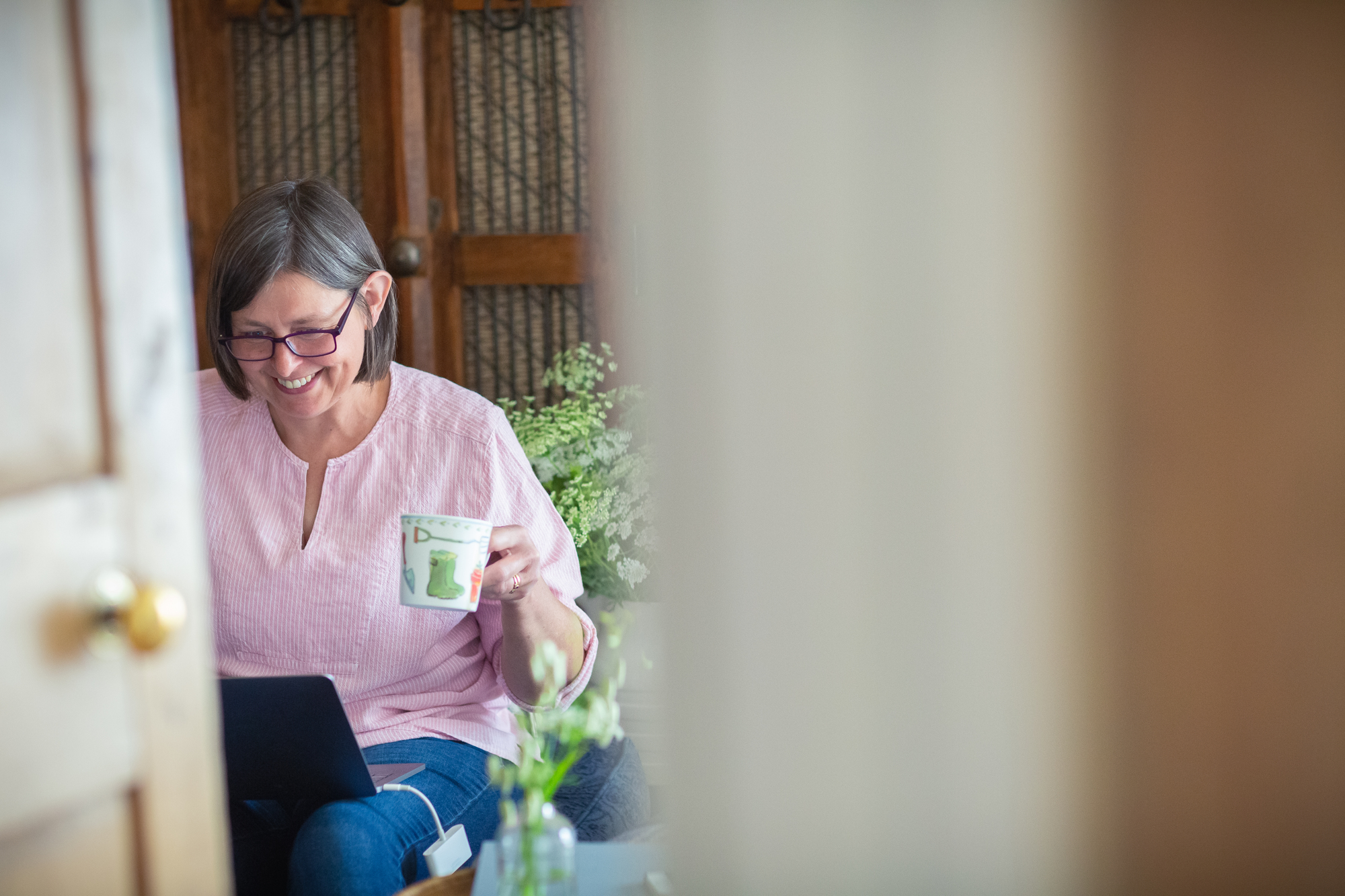 What does your day look like? Carole answers emails with a cup of coffee at the start of her working day.