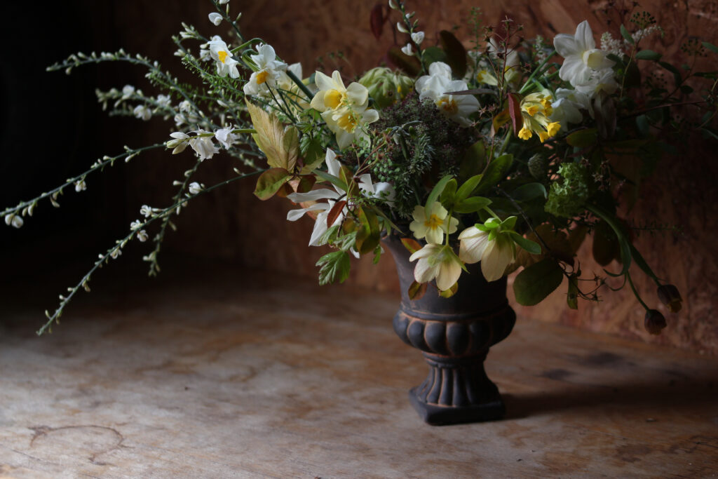 Tuckshop Flowers small urn with yellow and white spring flowers from a 1:1 workshop.