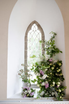 Beechfield Flowers Farm created this beautiful pastel toned, perfumed display of seasonal, local British flowers to climb alongside a gothic church window.