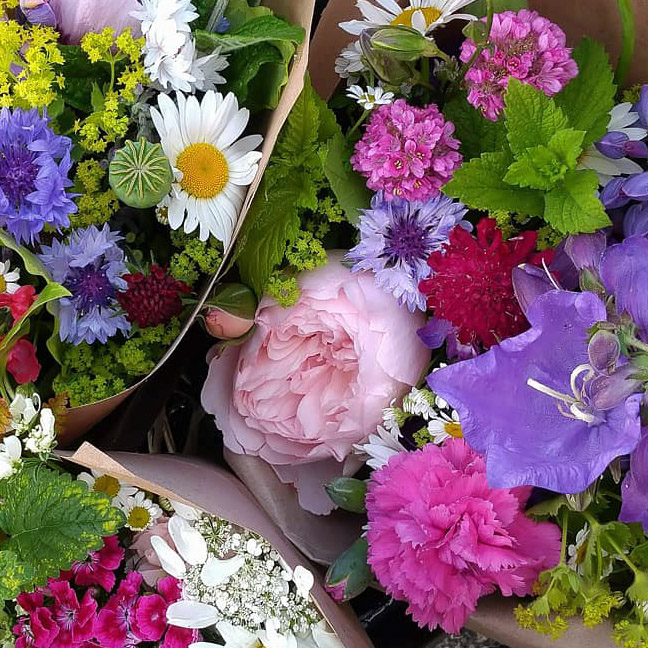 Bouquets of freshly picked locally grown flowers await delivery