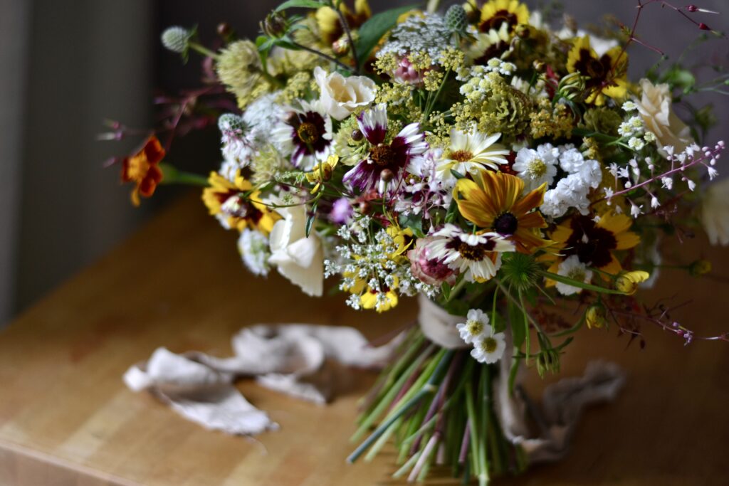 A summer bouquet of yellow and deep red flowers