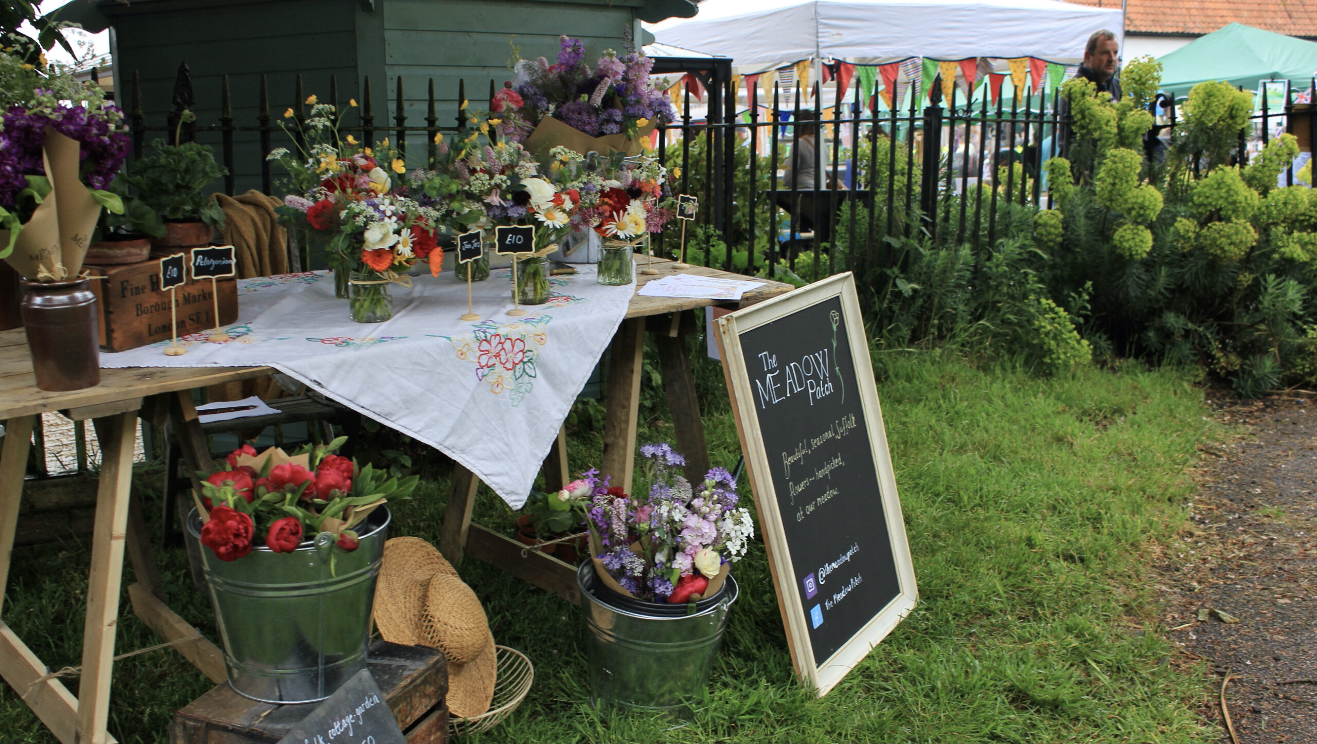 Locally grown flowers being sold at market by The Meadow Patch