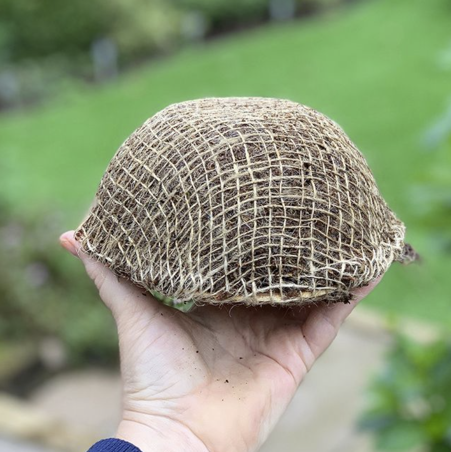 Moss mixed with coir fibre and wrapped in hessian is one example of environmentally friendly floral mechanics