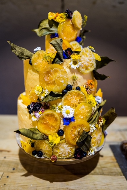 A stunning tiered wedding cake decorated with British edible flowers and foliage grown by Yorkshire Edible flowers