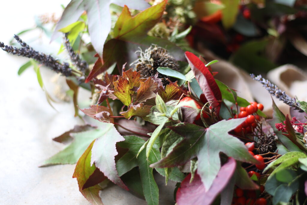 A leafy autumn wreath by Camomile and Cornflowers shows all the colours of the season.