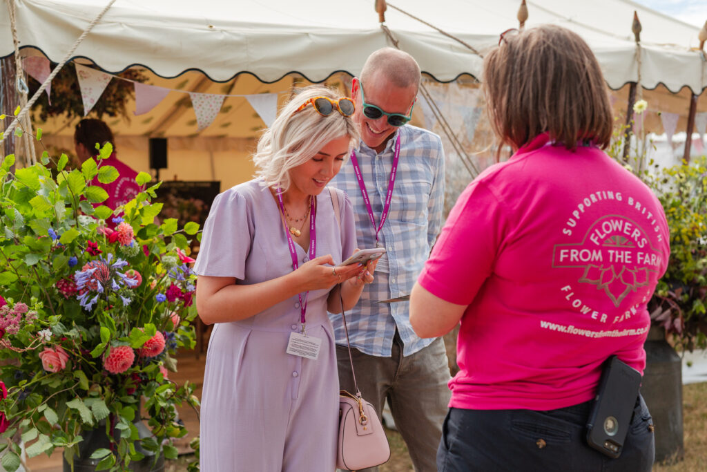 FFTF co-chair Meg Edmonds welcomes visitors to the FFTF Flower School at the RHS Hampton Court Festival