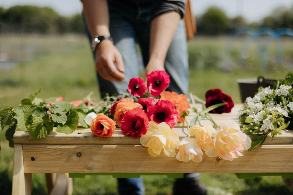 Susie Ross of Wivenhoe Flowers starting to assemble a bouquet from a beautiful selection of flowers she has grown on her plot