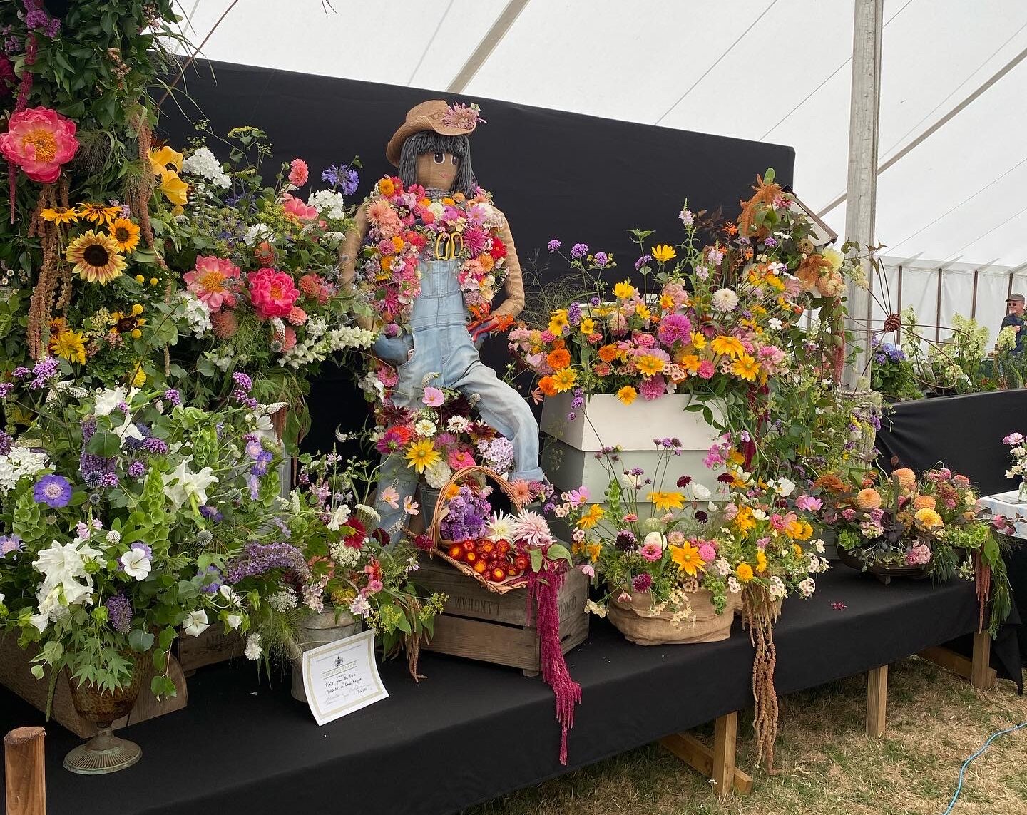 Lily the Scarecrow, gracing the Flowers from the Farm display at the 2022 Sandringham Show