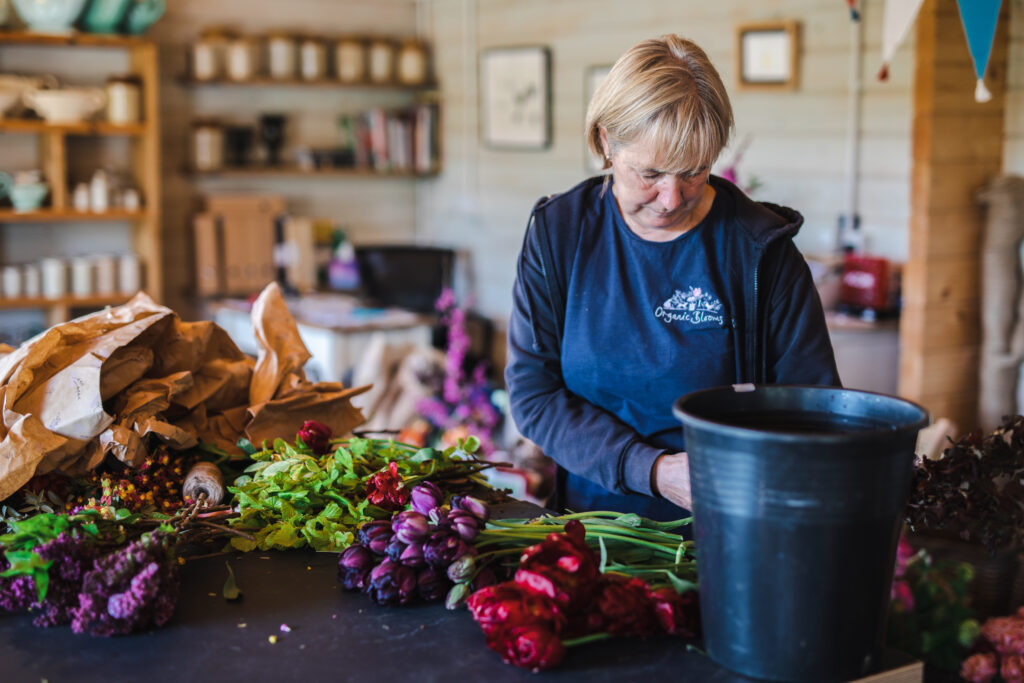 Co-chair Wendy Paul chooses only the best blooms from the workshop to go into the supplies for the Westminster Abbey coronation displays.