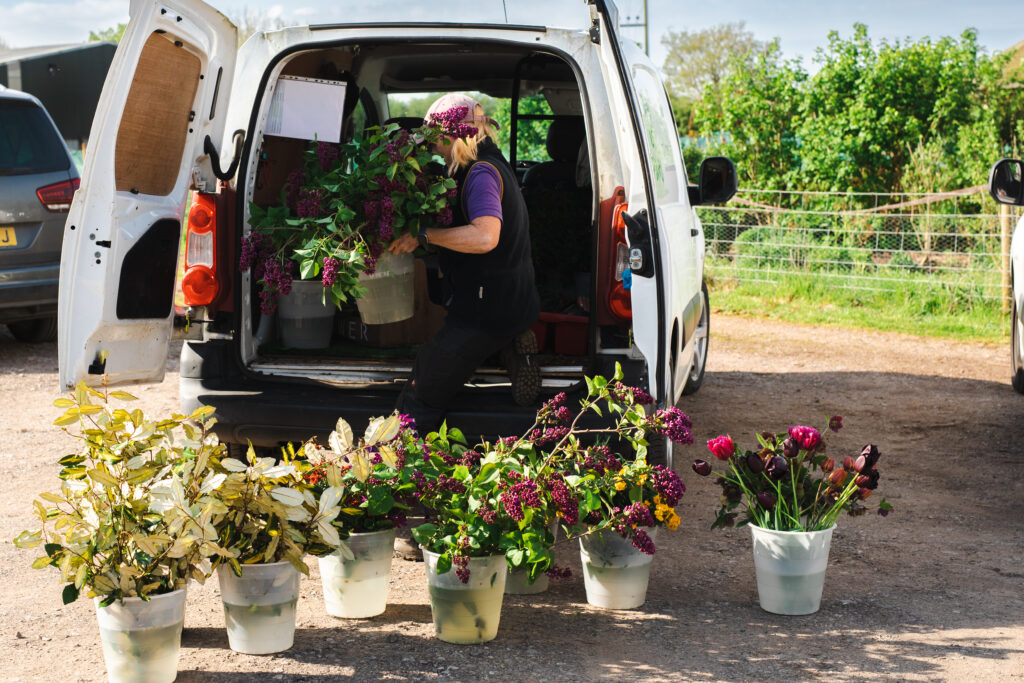 Loading up the van with buckets of freshly cut flowers ready for departure to Westminster Abbey for the Coronation