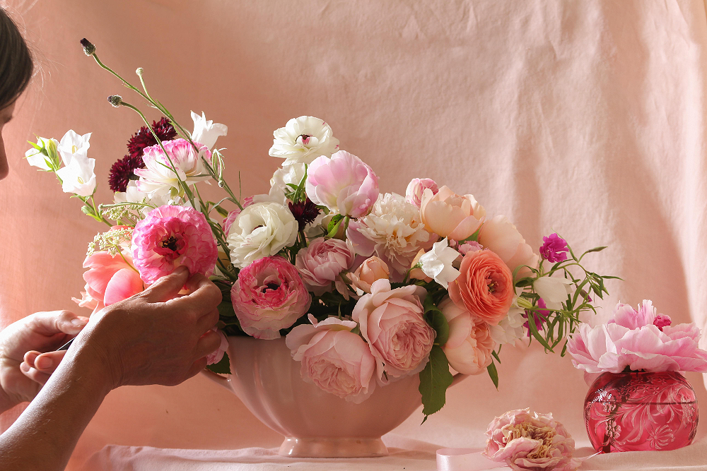 pink roses, ranunculus and peonies in a pink vase