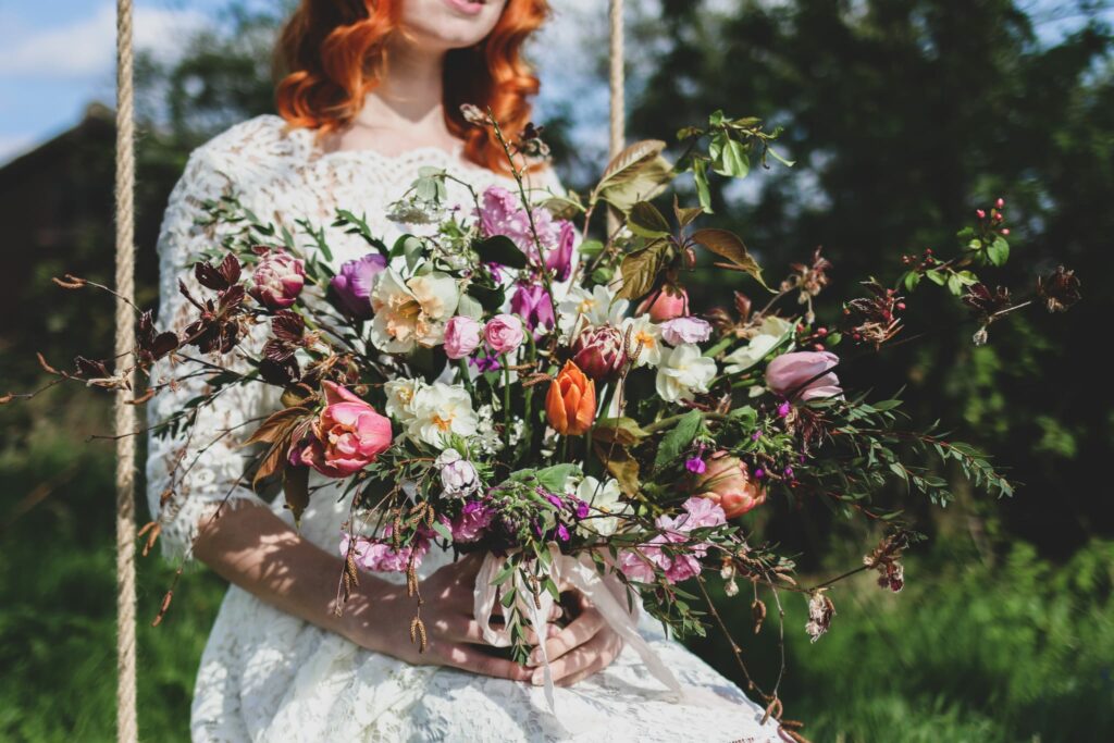 Bride on a swing holding a bouquet