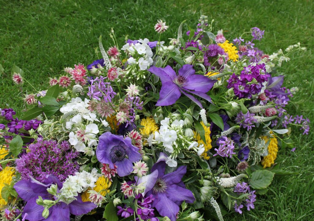 The Posy Patch spring funeral casket spray with anemones